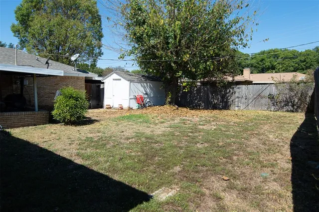 a view of a backyard of the house