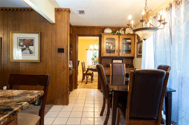 a view of a dining room with furniture and window