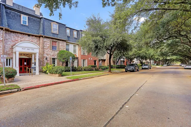 a view of street with parked cars