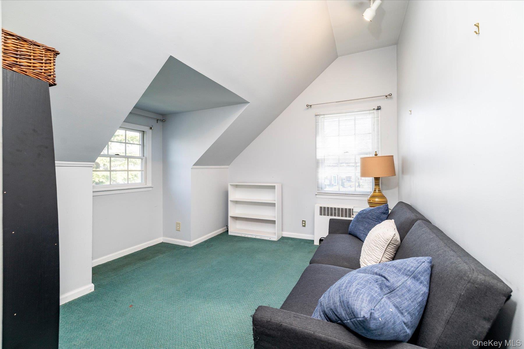 11 Maple Street Malverne, NY 11565 - Photo 14 of 18 a living room with furniture and a window