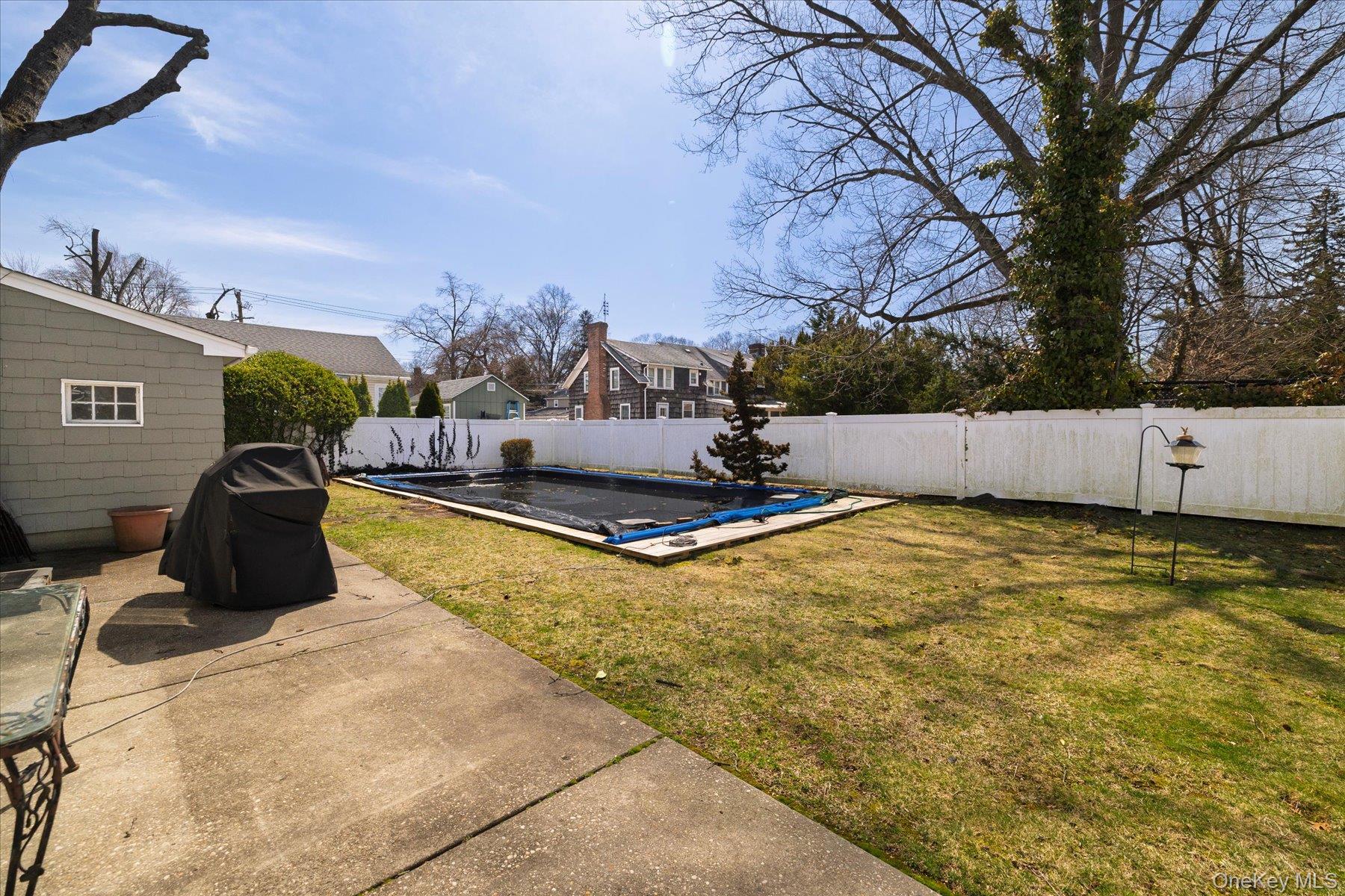 11 Maple Street Malverne, NY 11565 - Photo 17 of 18 a view of a swimming pool with an outdoor seating