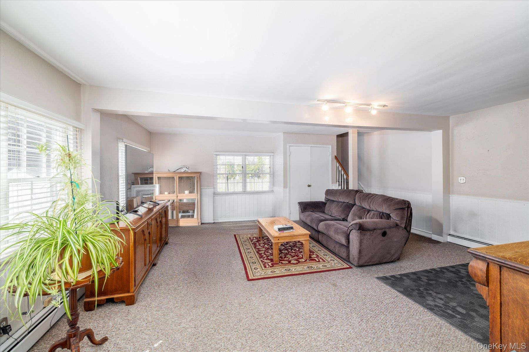 11 Maple Street Malverne, NY 11565 - Photo 9 of 18 a living room with furniture and a large window