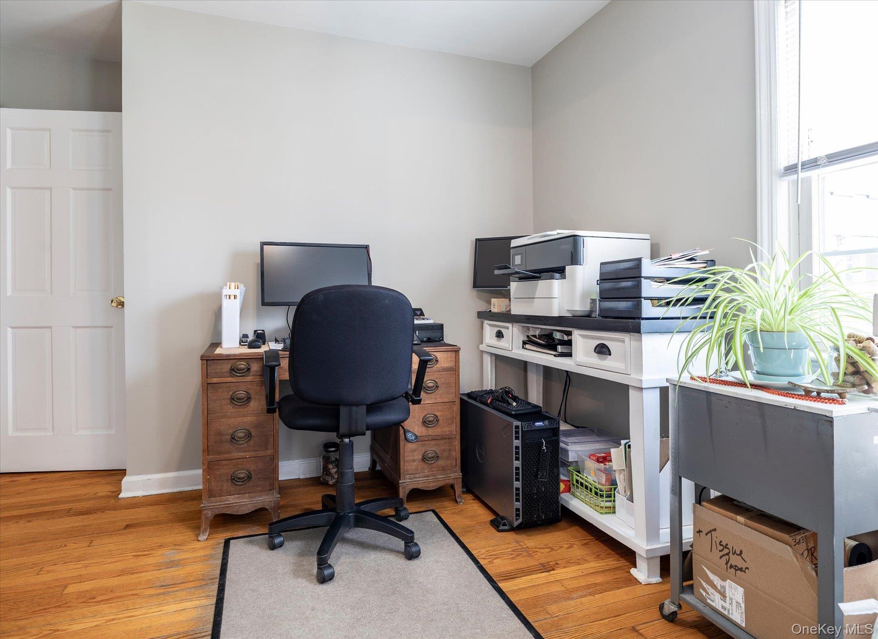 11 Maple Street Malverne, NY 11565 - Photo 10 of 18 a view of a workspace with furniture and a window
