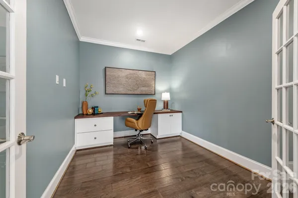 a workspace with furniture and window
