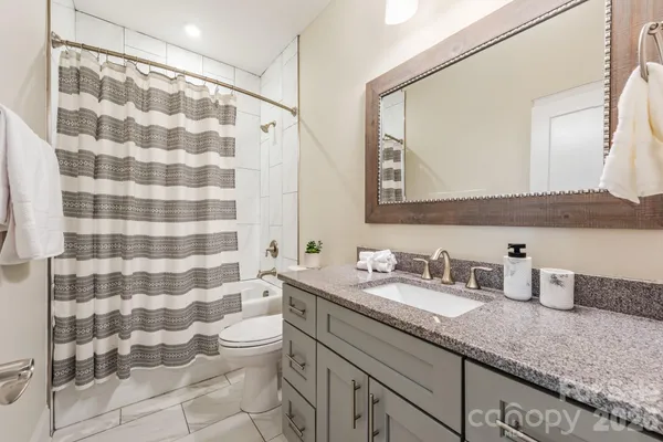 a view of entryway with wooden floor and stairs