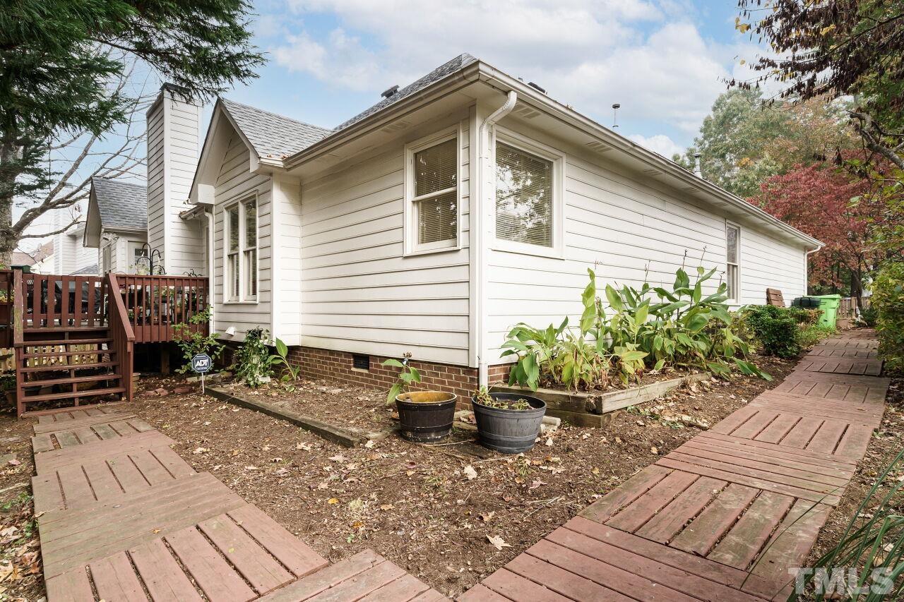 5305 Calverton Drive Raleigh, NC 27613 - Photo 29 of 34 a view of a backyard with sitting area