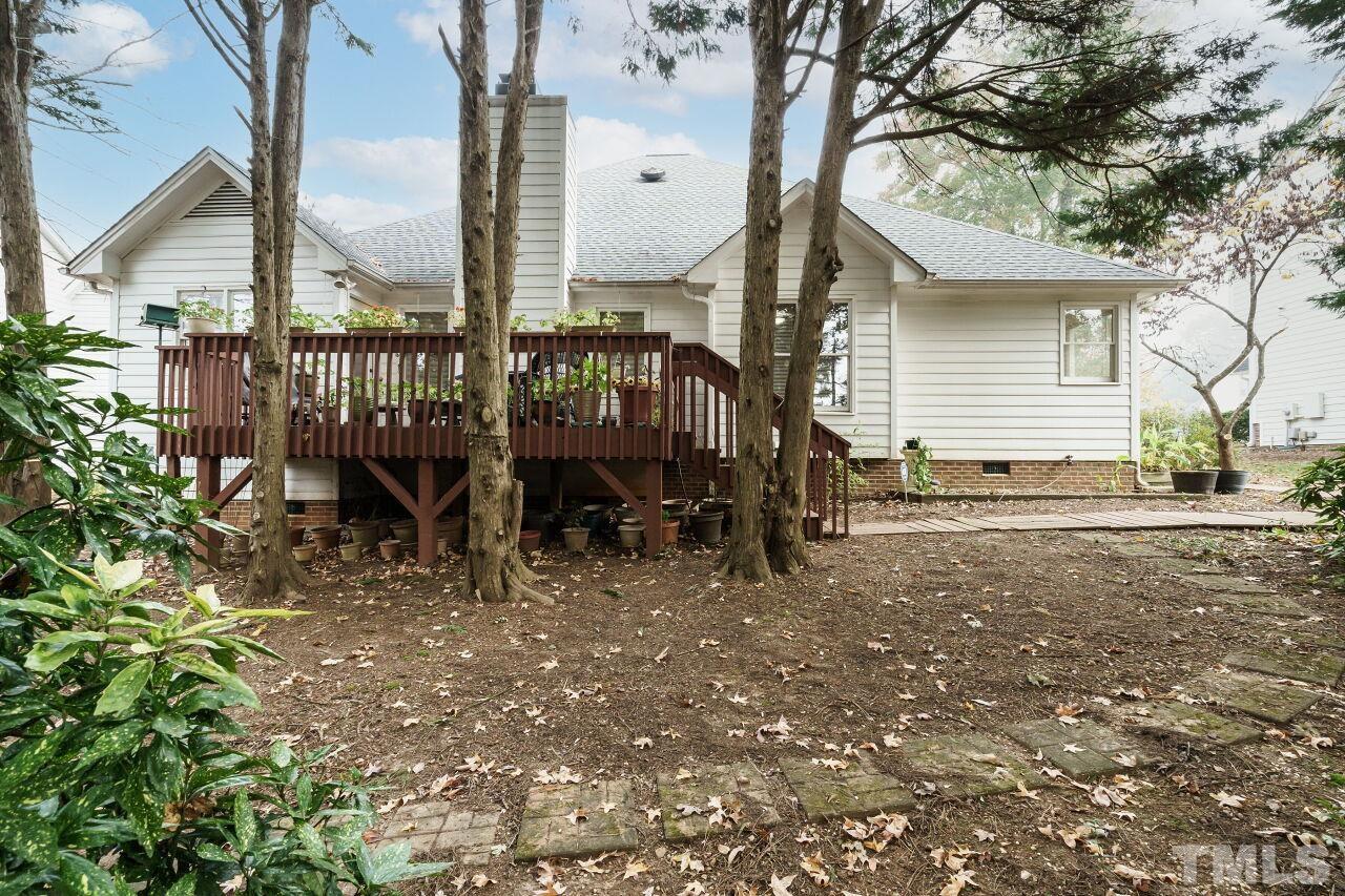 5305 Calverton Drive Raleigh, NC 27613 - Photo 30 of 34 a view of a house with backyard and sitting area