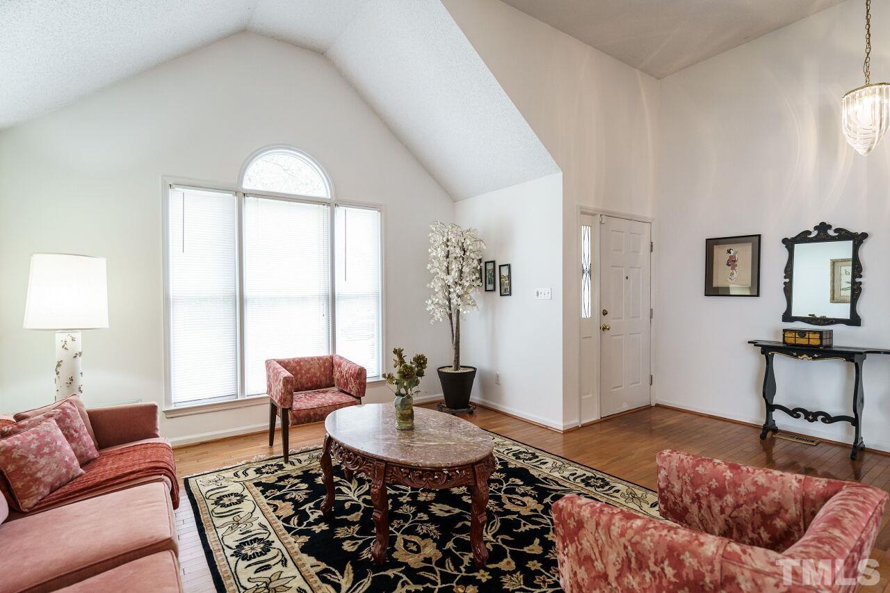 5305 Calverton Drive Raleigh, NC 27613 - Photo 3 of 34 a living room with furniture and a window