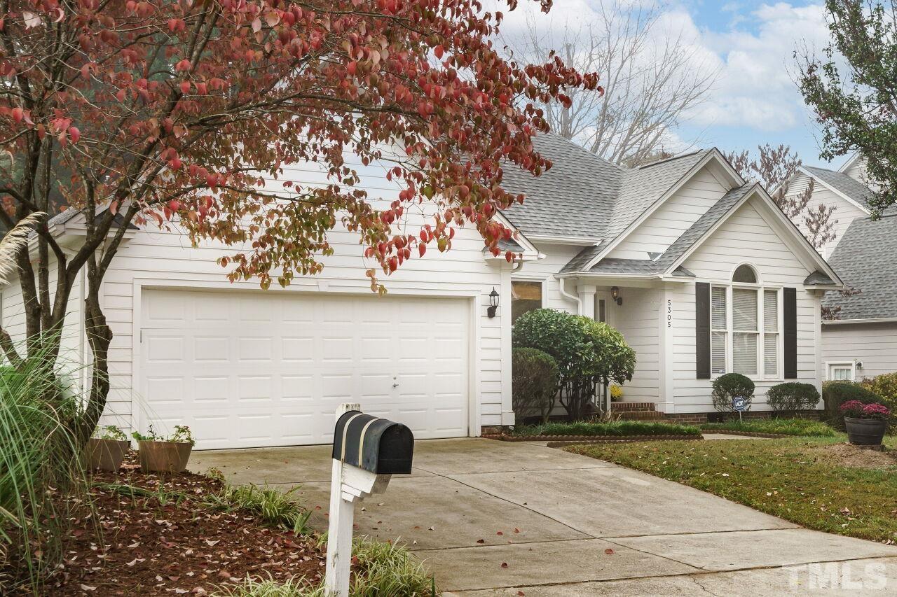 5305 Calverton Drive Raleigh, NC 27613 - Photo 31 of 34 a front view of a house with garden