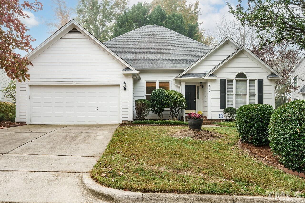 5305 Calverton Drive Raleigh, NC 27613 - Photo 33 of 34 a view of a house with backyard