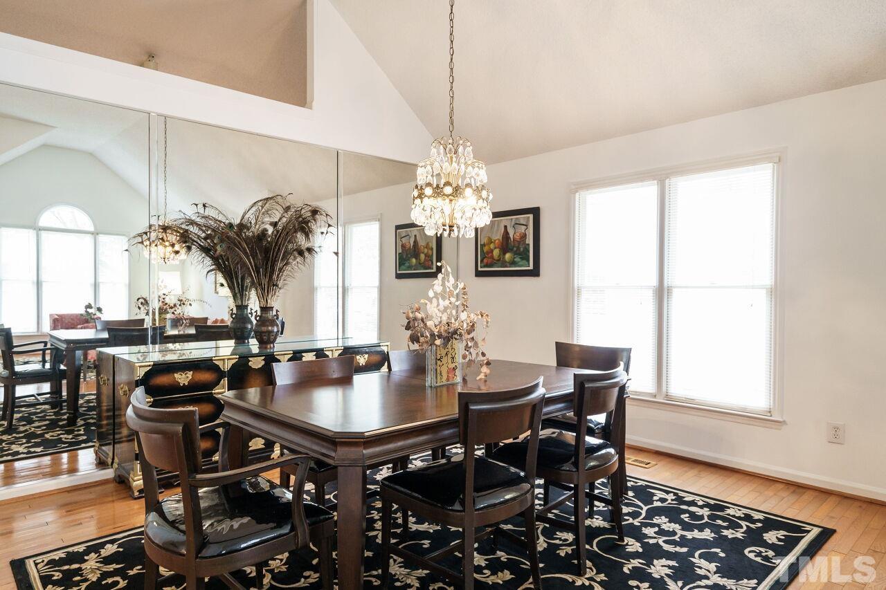5305 Calverton Drive Raleigh, NC 27613 - Photo 8 of 34 a view of a dining room with furniture and window