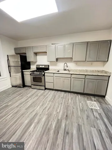 a front view of a house with a yard and a garage