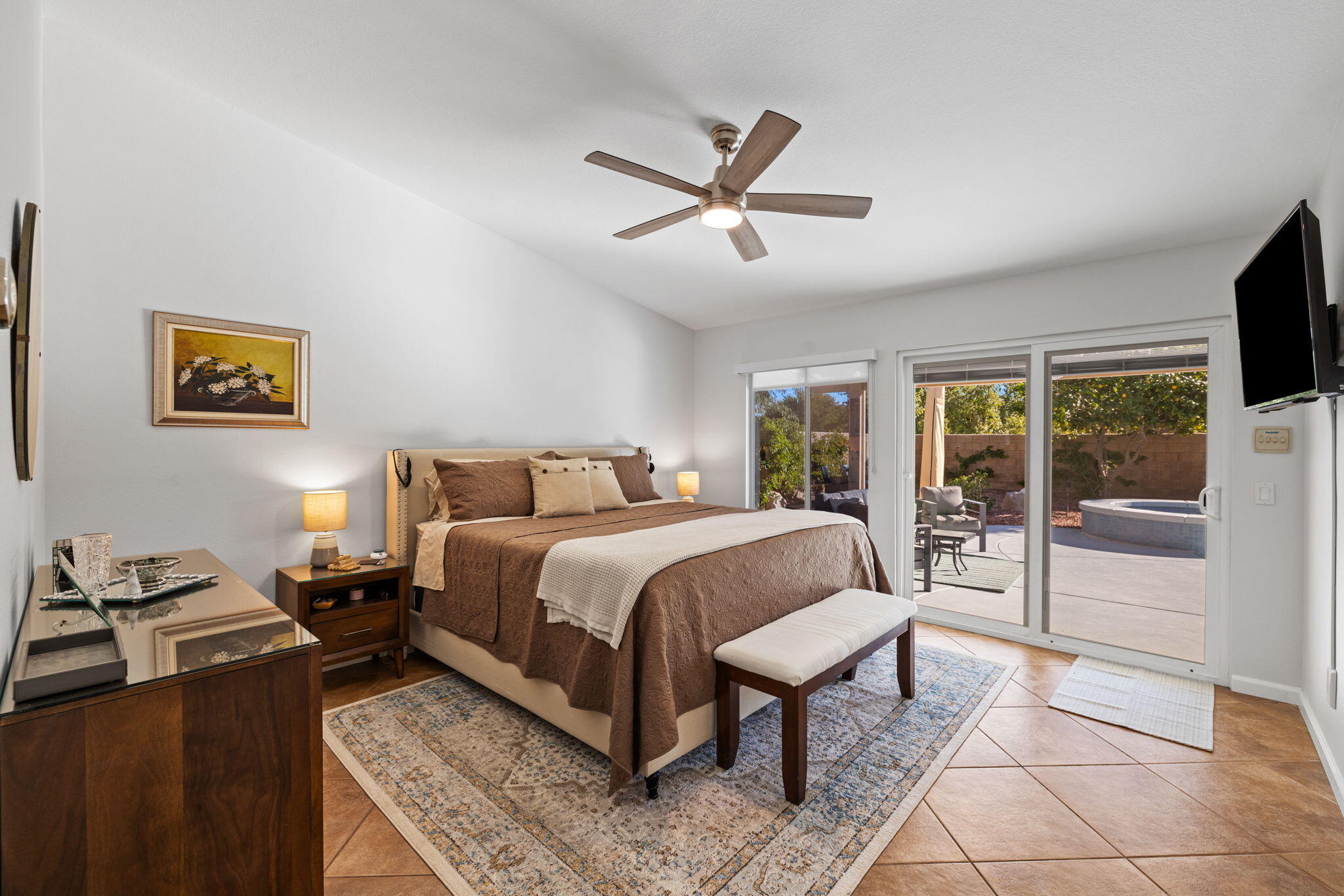 81107 Portola Circle Indio, CA 92201 - Photo 16 of 40 a bedroom with a bed and a flat screen tv