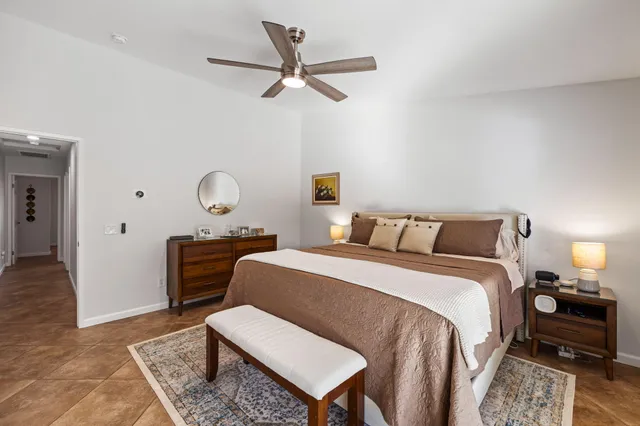 a bed room with a bed window and a couch