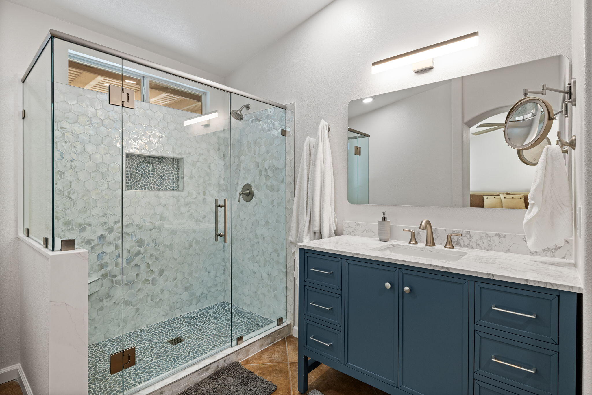 81107 Portola Circle Indio, CA 92201 - Photo 19 of 40 a bathroom with a shower sink and mirror