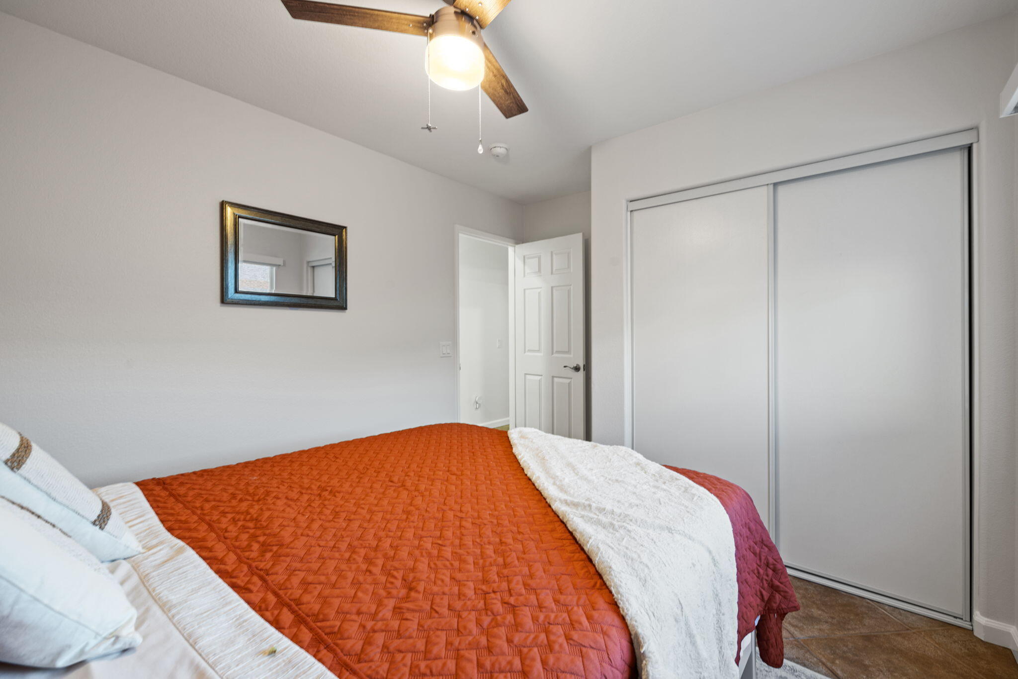 81107 Portola Circle Indio, CA 92201 - Photo 20 of 40 a bed room with a bed and a painting on the wall