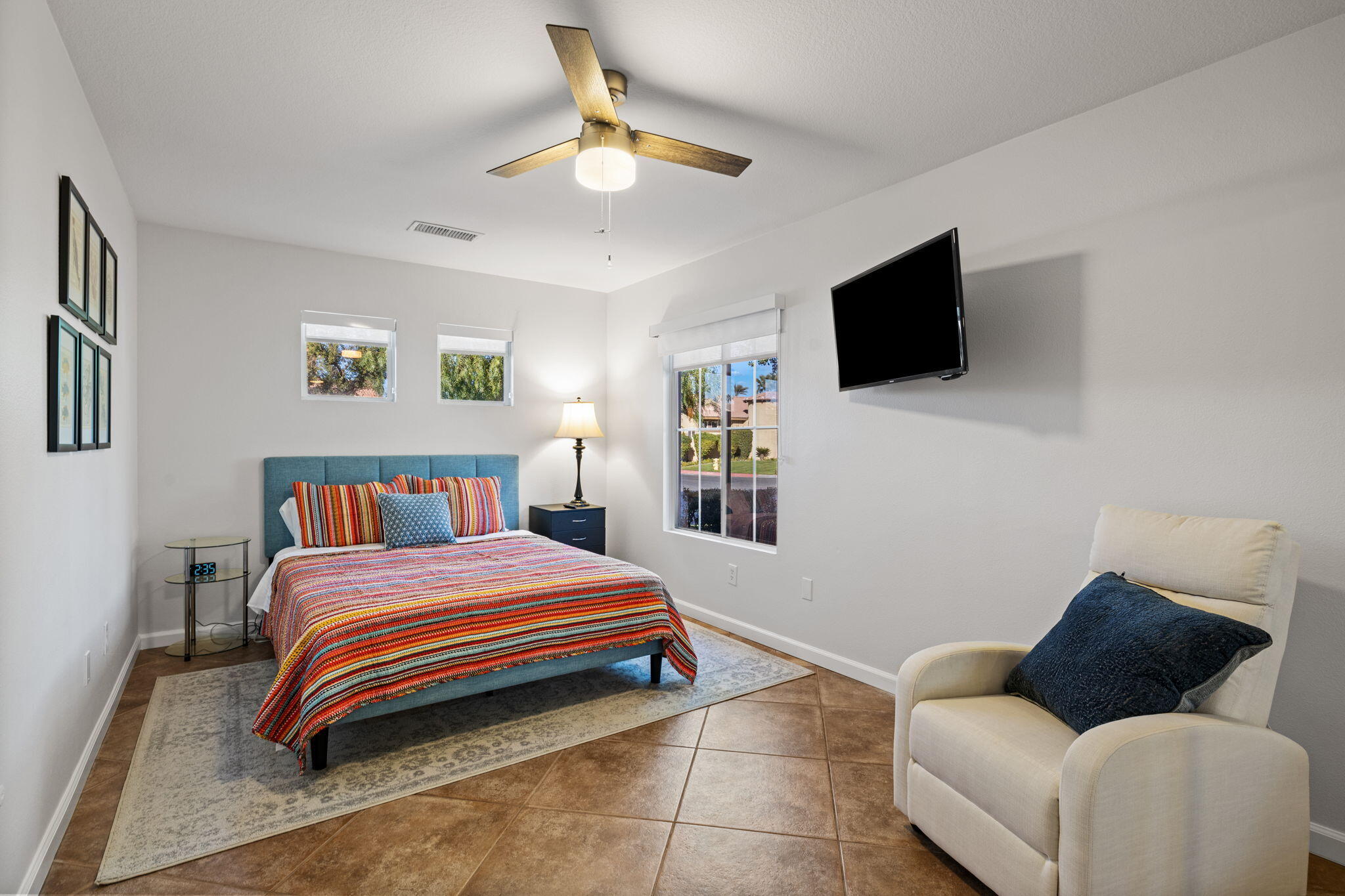 81107 Portola Circle Indio, CA 92201 - Photo 25 of 40 a bedroom with a bed and a flat screen tv