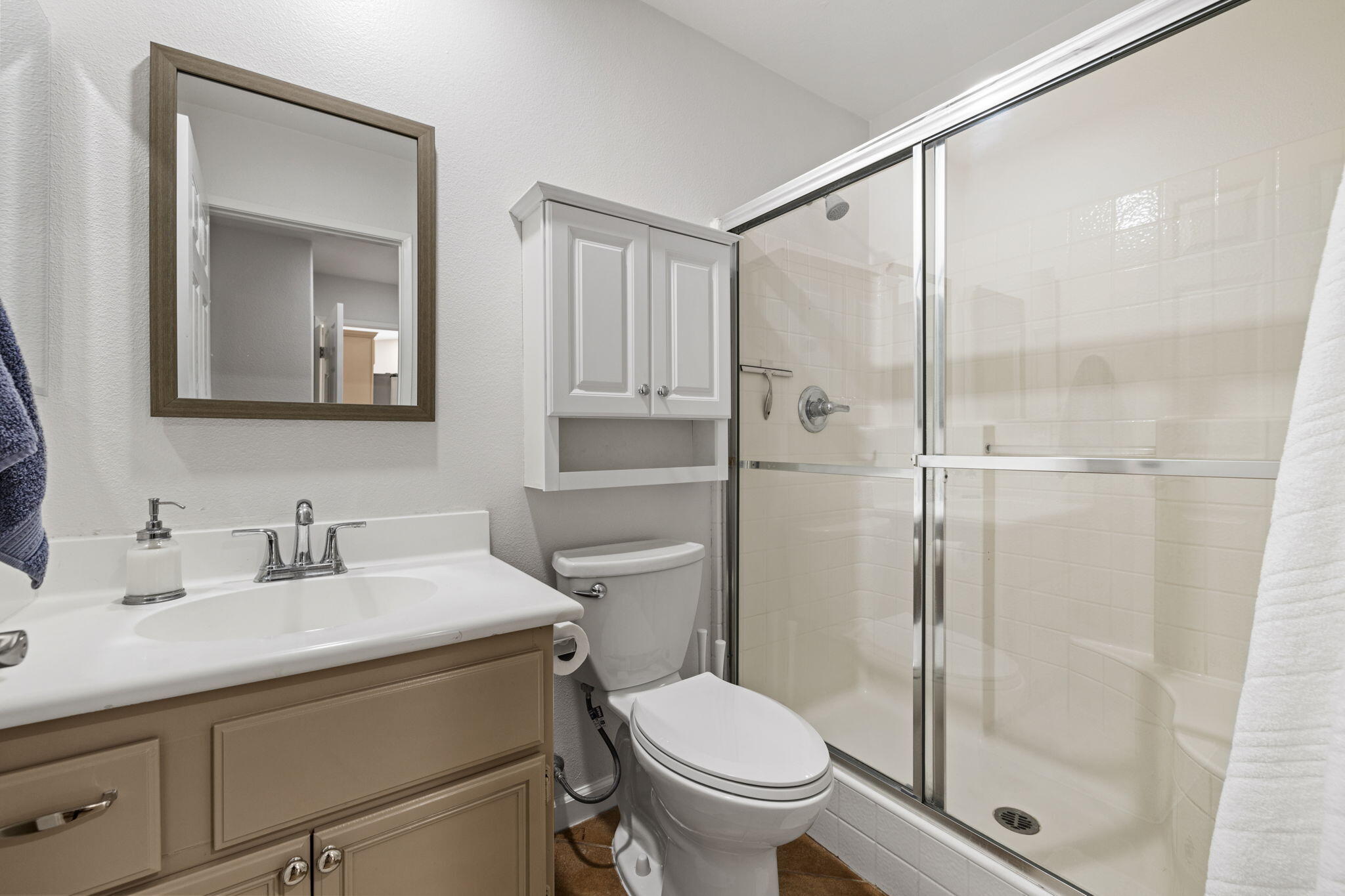 81107 Portola Circle Indio, CA 92201 - Photo 27 of 40 a bathroom with a toilet a sink and glass door