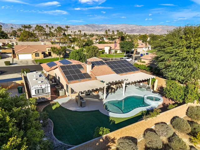 an aerial view of a house with outdoor space