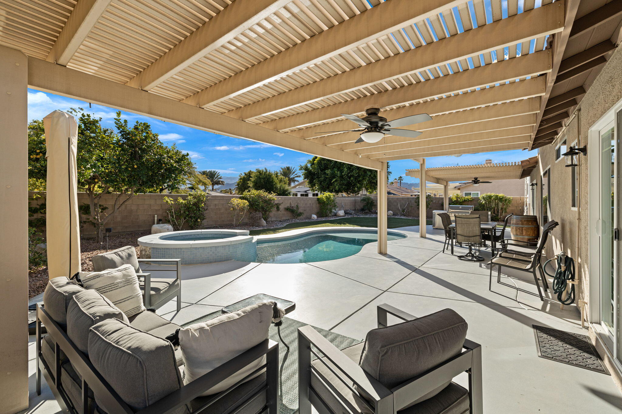 81107 Portola Circle Indio, CA 92201 - Photo 37 of 40 a outdoor living space with patio furniture and a potted plant