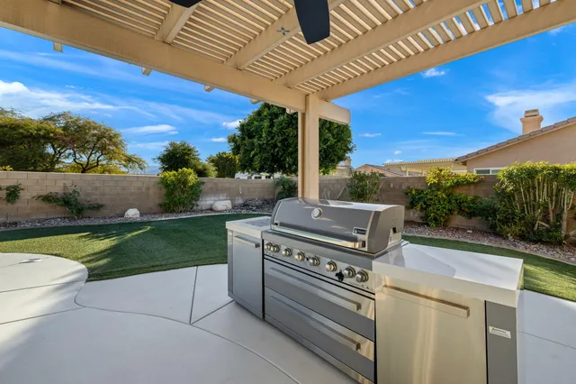 a view of a backyard with seating area
