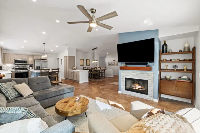 a living room with furniture and a fireplace