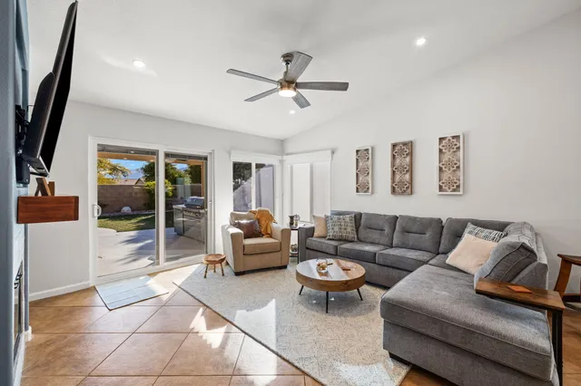 a living room with furniture and a window