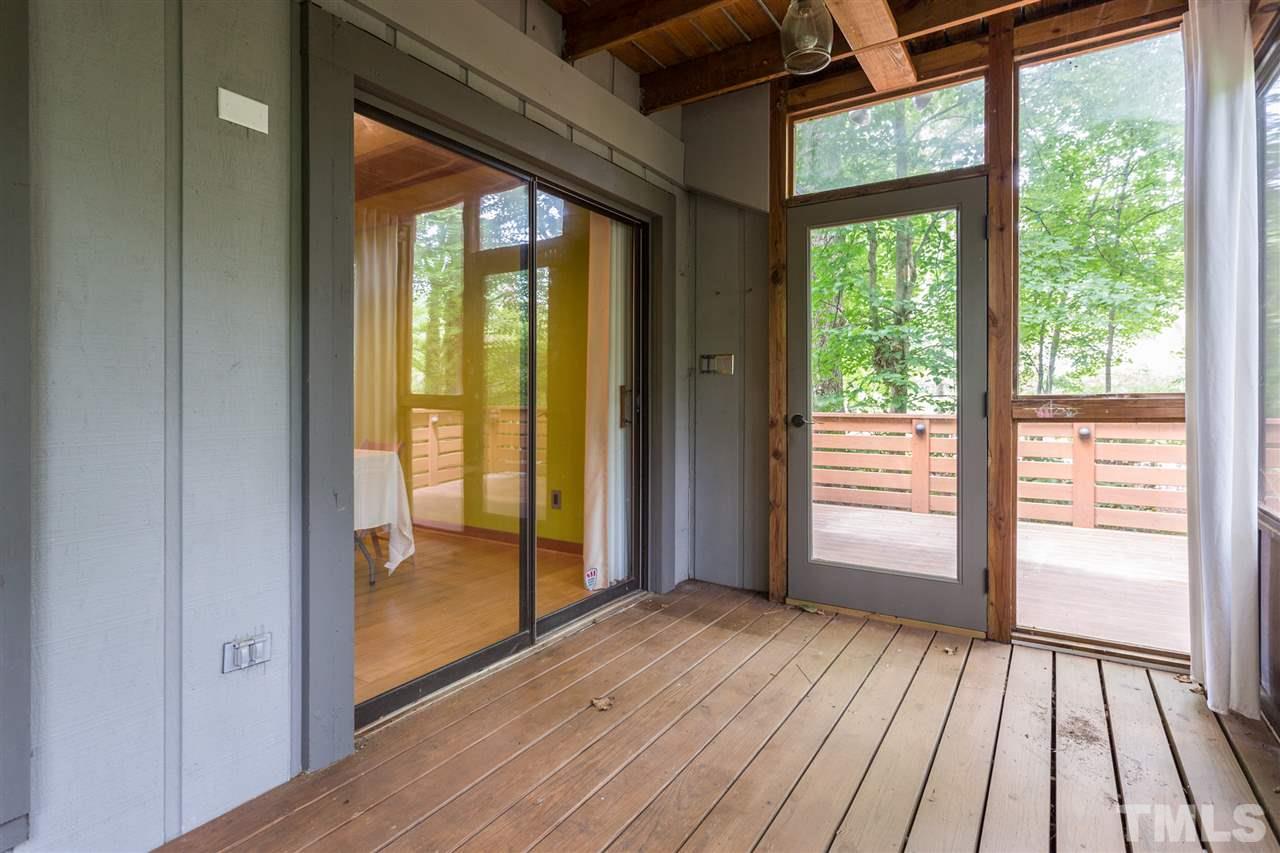 2733 Rue Sans Famille Raleigh, NC 27607 - Photo 20 of 25 a view of an empty room with wooden floor and a window