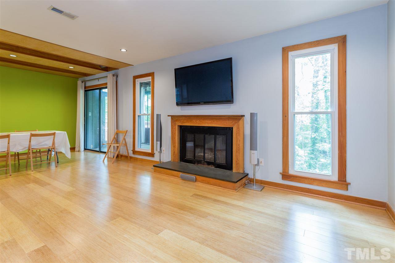 2733 Rue Sans Famille Raleigh, NC 27607 - Photo 3 of 25 a view of an empty room with window and fireplace