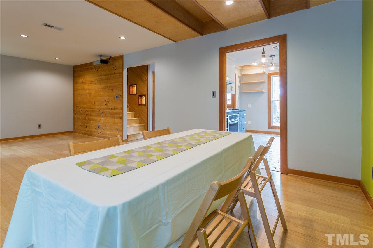 2733 Rue Sans Famille Raleigh, NC 27607 - Photo 6 of 25 a bedroom with a bed and a table