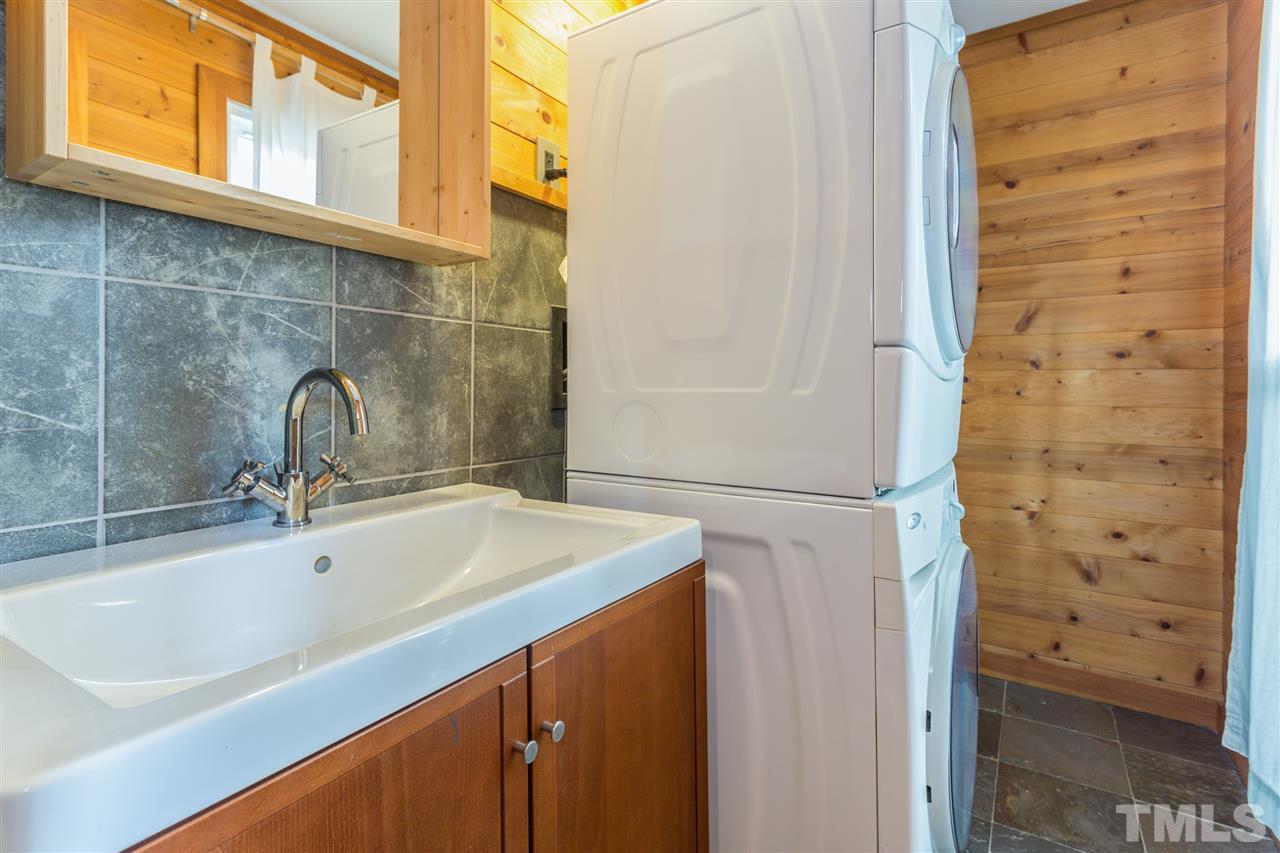 2733 Rue Sans Famille Raleigh, NC 27607 - Photo 10 of 25 a bathroom with a sink and a shower