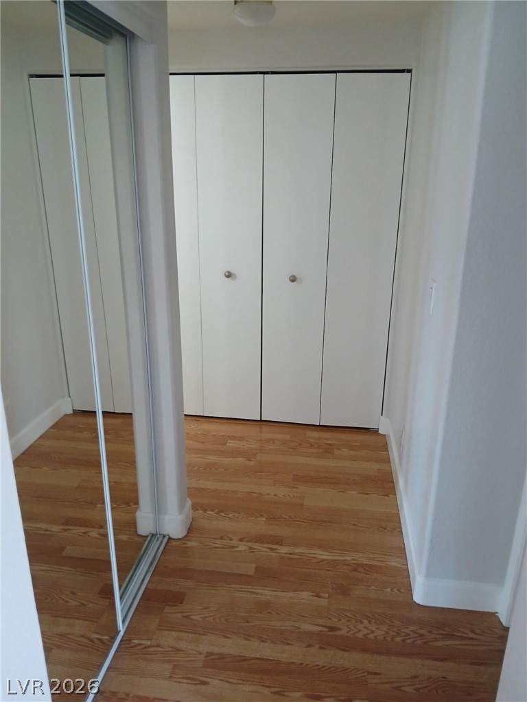2201 Ramsgate Drive, Unit 426 Henderson, NV 89074 - Photo 10 of 22 This interior hallway features sleek closet doors and durable hardwood flooring.
