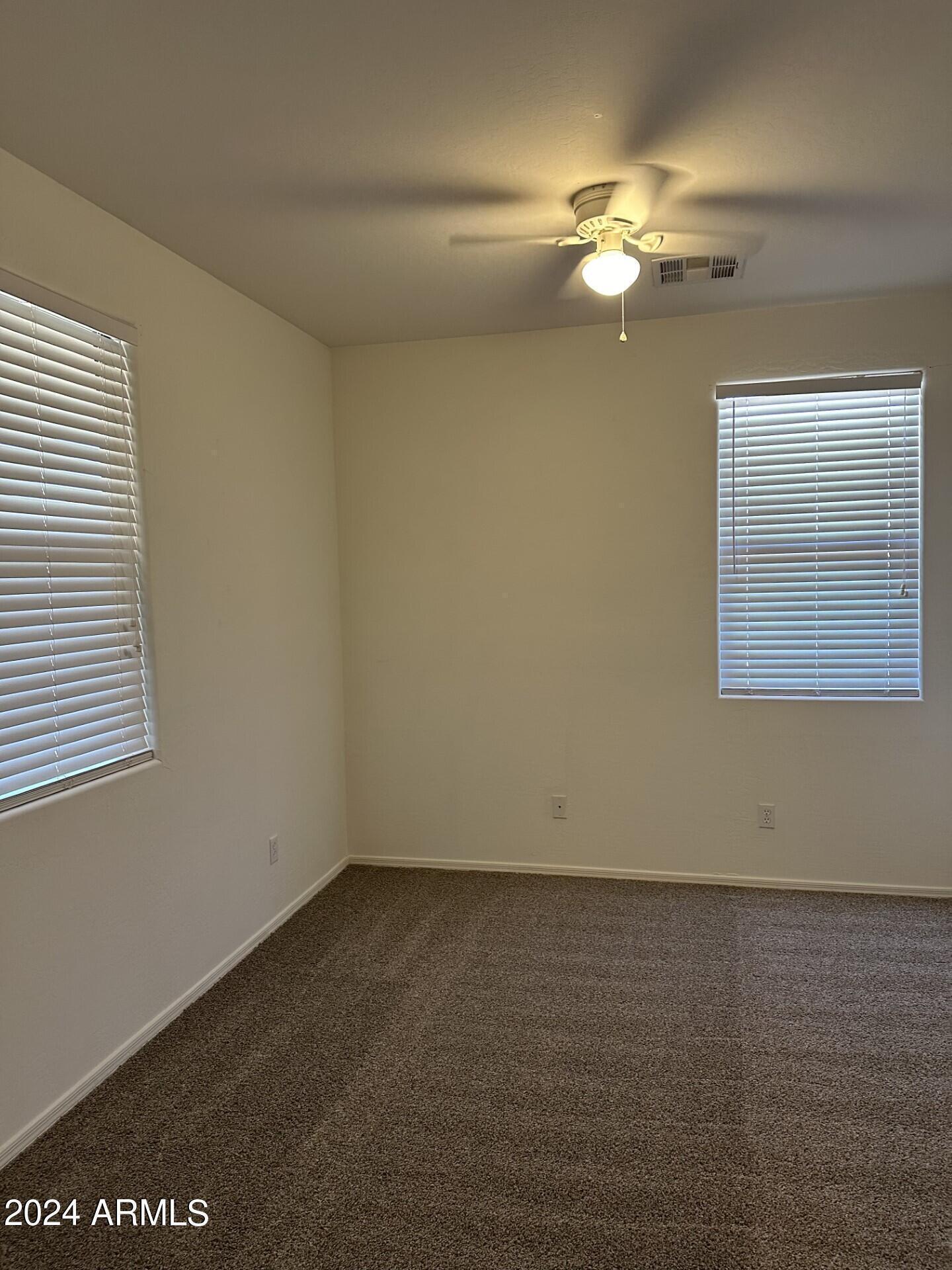 44456 West Eddie Way Maricopa, AZ 85138 - Photo 13 of 18 a view of a room with a fan