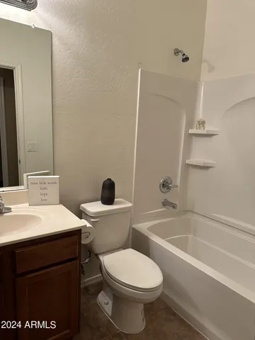 a bathroom with a sink a toilet and a bathtub