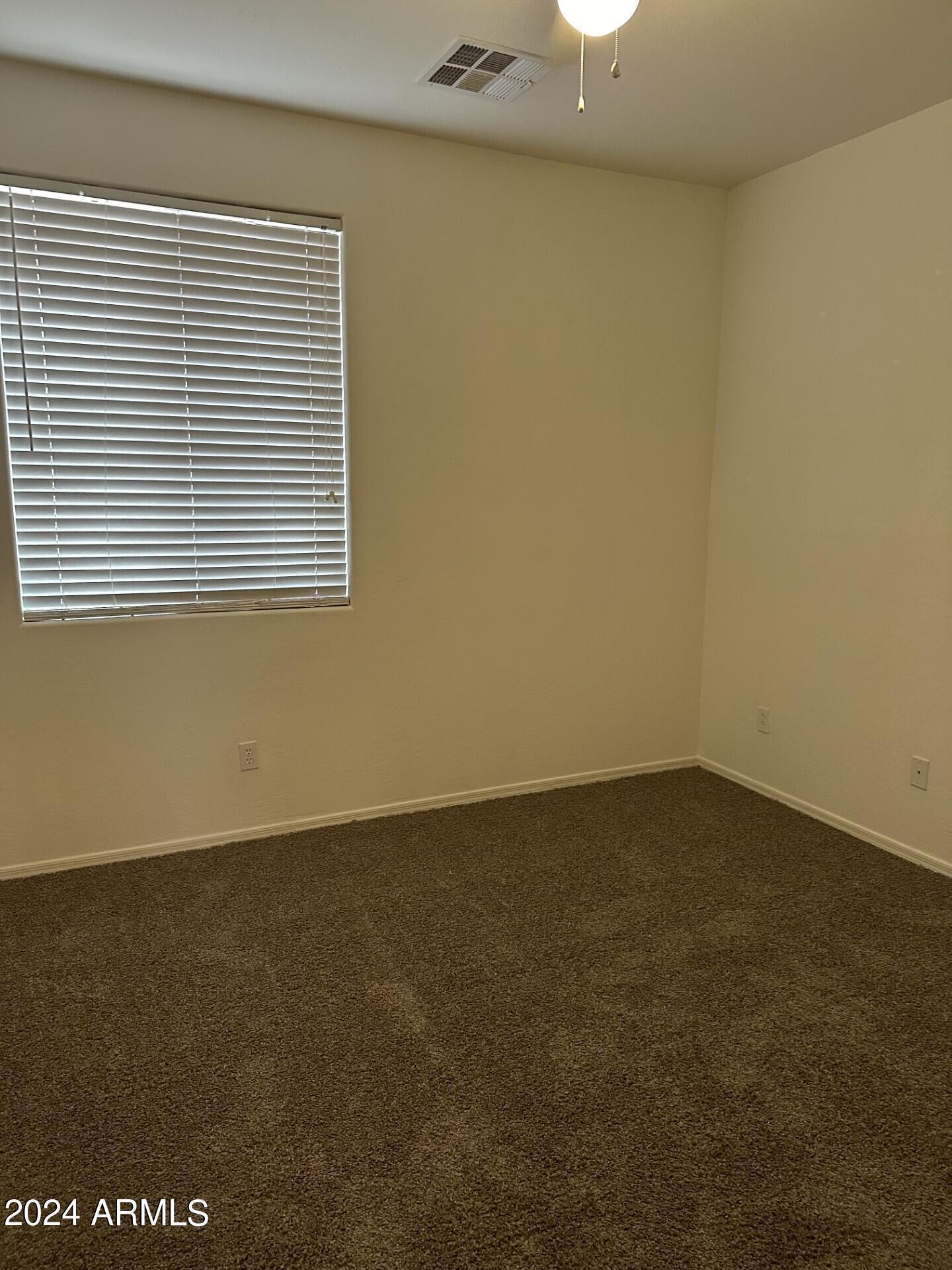 44456 West Eddie Way Maricopa, AZ 85138 - Photo 7 of 18 an empty room with a window