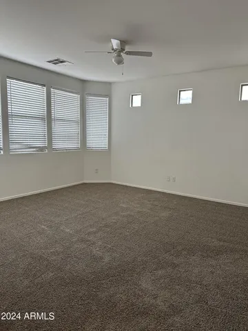 an empty room with a empty space and a window