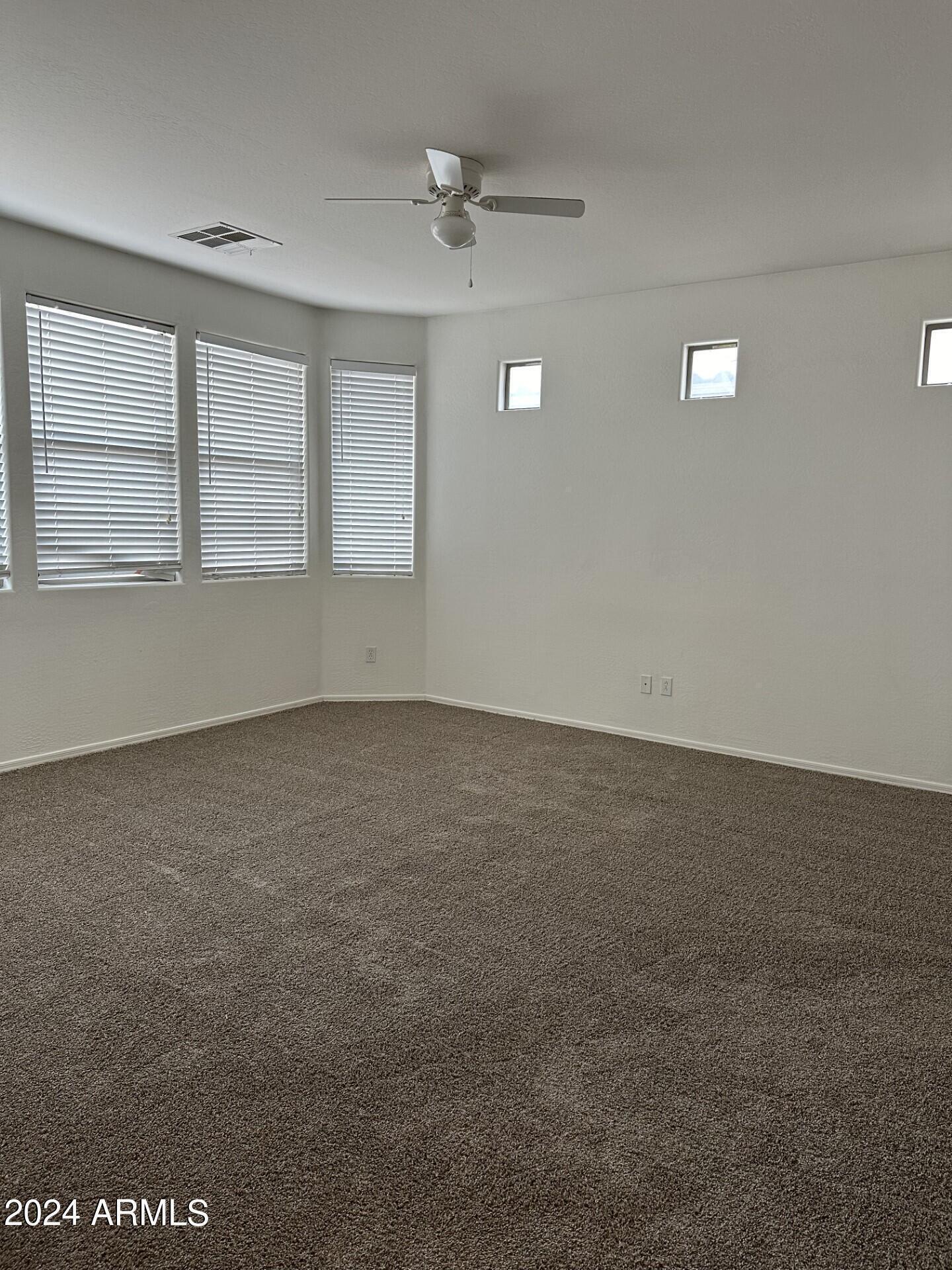 44456 West Eddie Way Maricopa, AZ 85138 - Photo 9 of 18 an empty room with a empty space and a window
