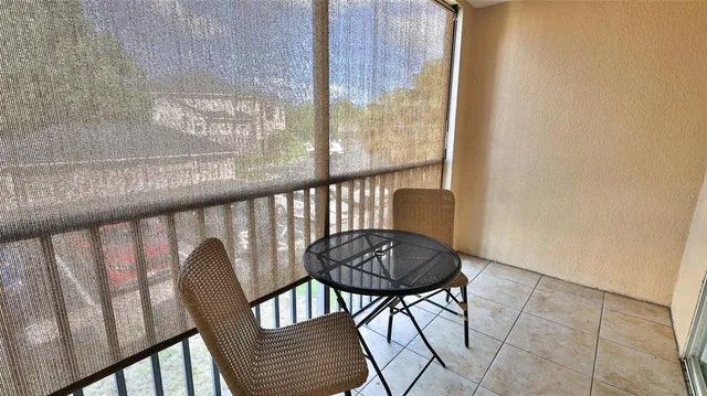 a view of a balcony with furniture