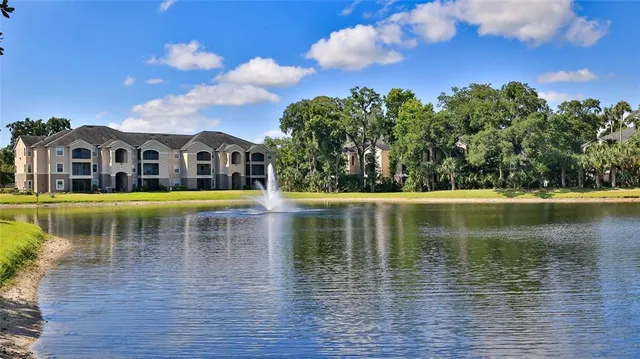 a view of a lake with a house in the background