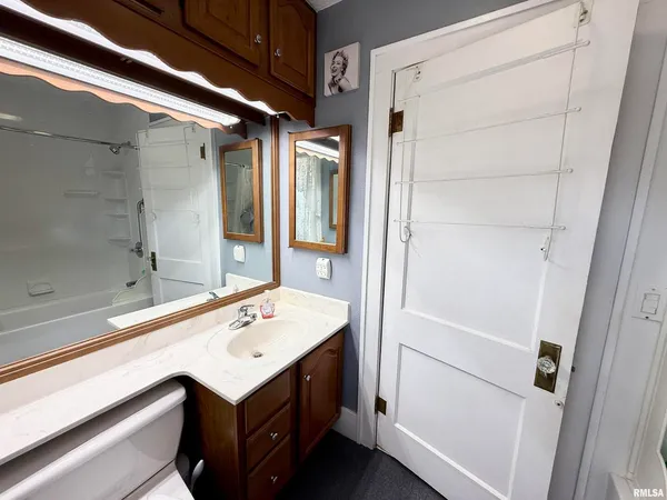 a bathroom with a sink and mirror