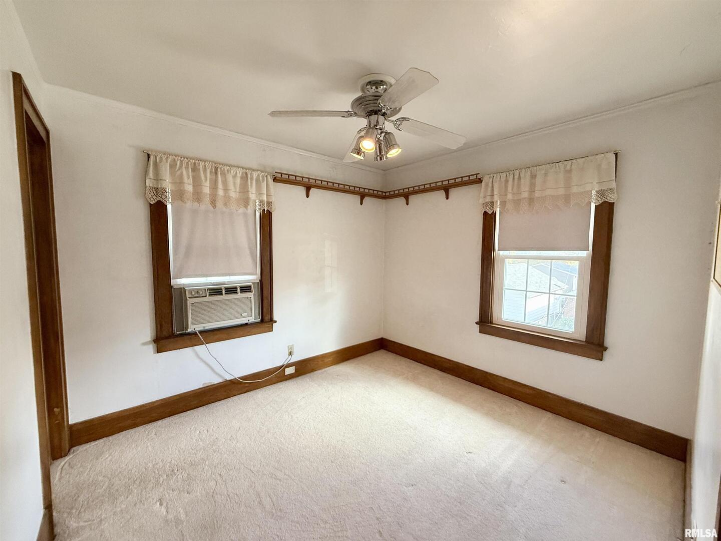 2340 7th Street East Moline, IL 61244 - Photo 15 of 26 an empty room with windows and fan