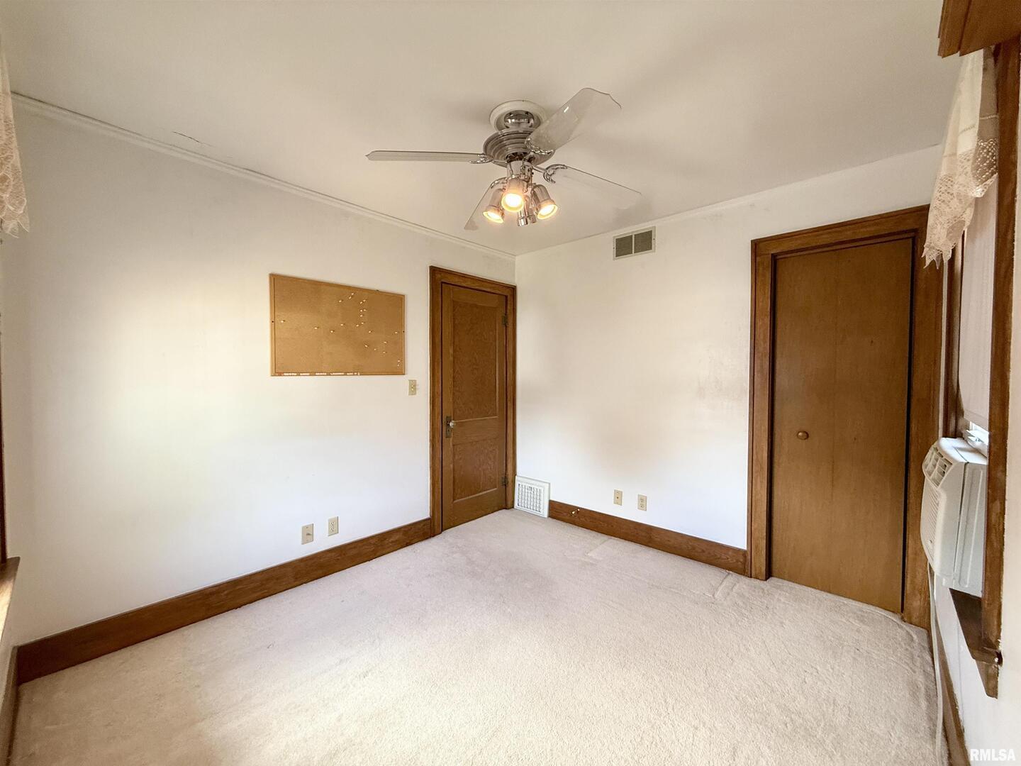 2340 7th Street East Moline, IL 61244 - Photo 16 of 26 a view of empty room with ceiling fan