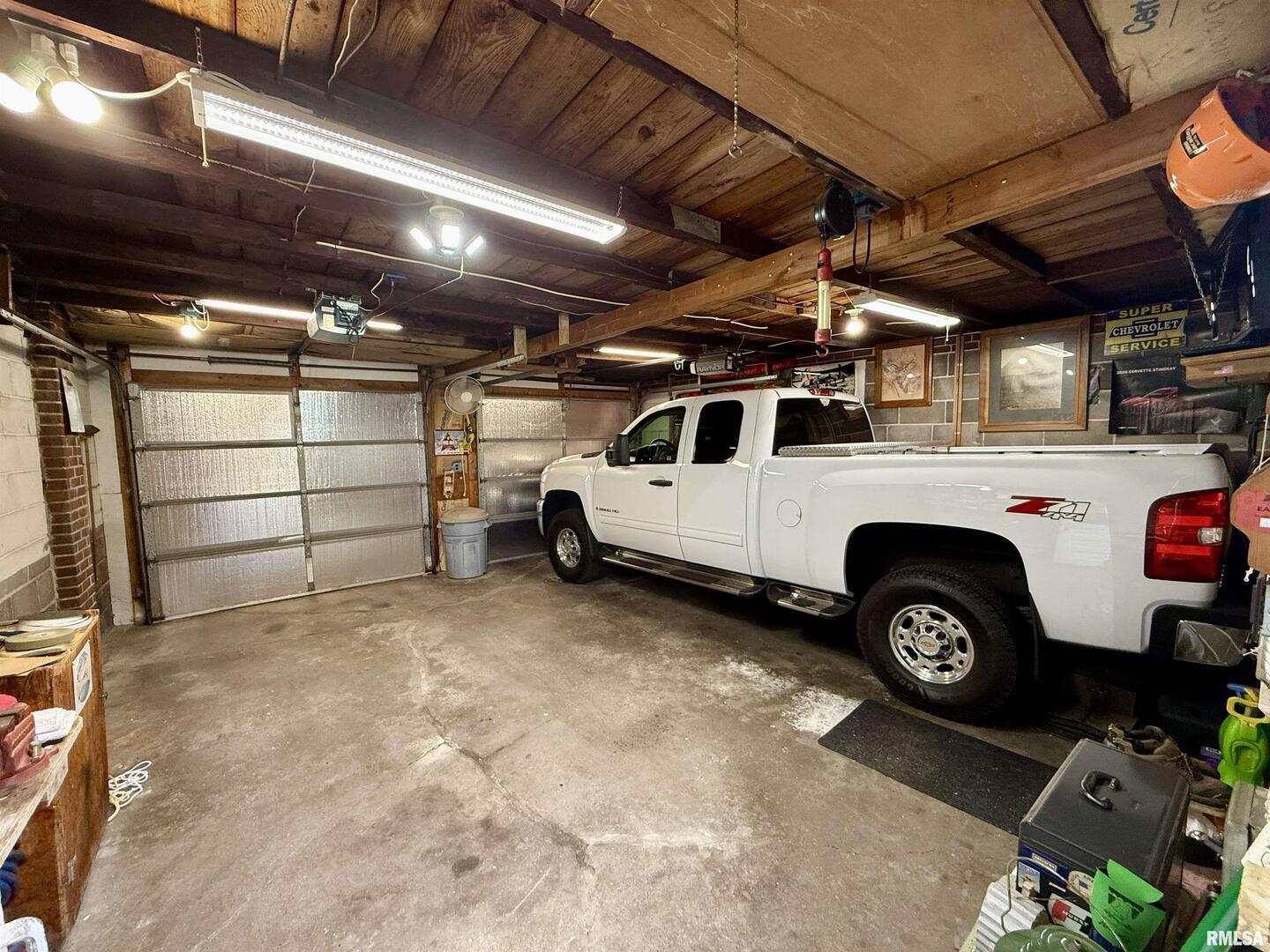2340 7th Street East Moline, IL 61244 - Photo 25 of 26 a utility room with a car parked car