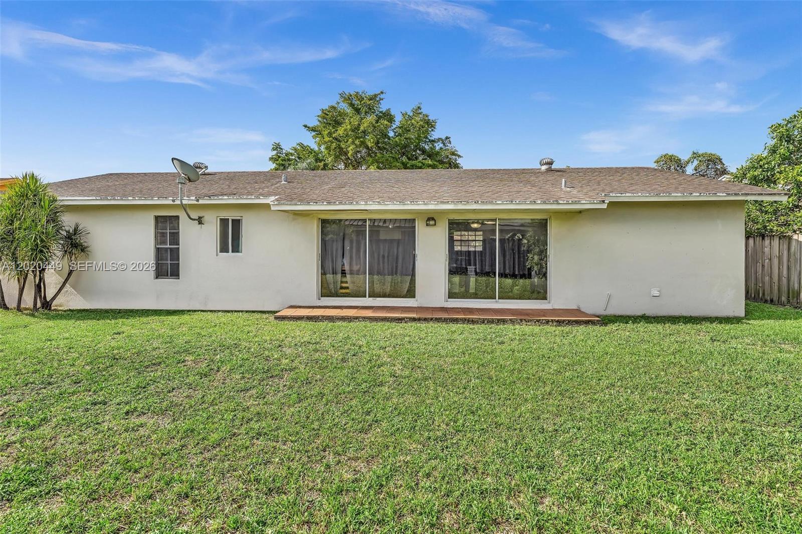 11061 Southwest 163rd Street Miami, FL 33157 - Photo 28 of 42 a view of a house with a backyard
