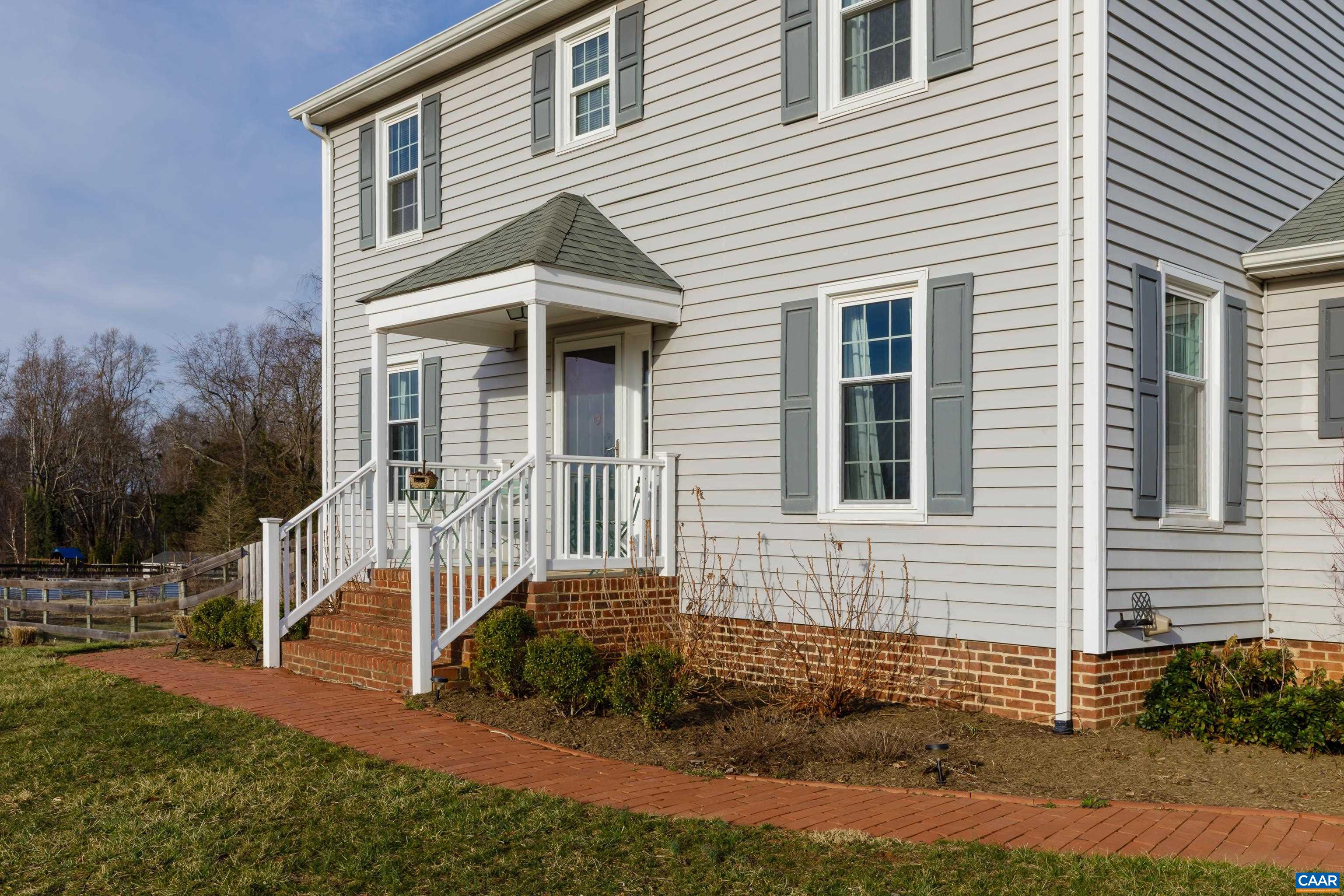 2706 Dunromin Road Charlottesville, VA 22901 - Photo 36 of 61 a front view of a house with a garden