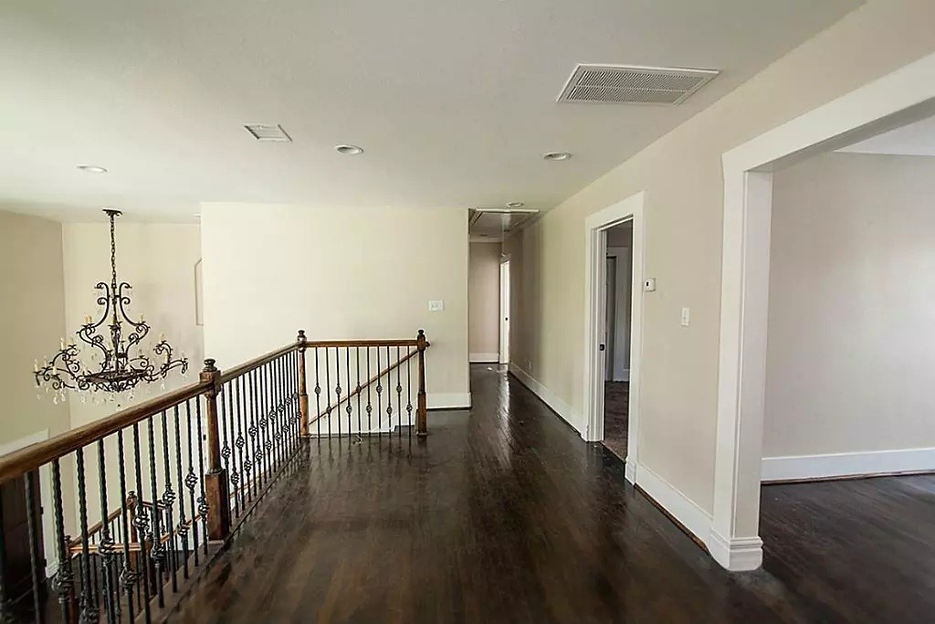 1452 Pearson Street Houston, TX 77023 - Photo 4 of 13 a view of a hallway with wooden floor