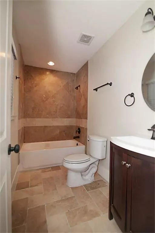 1452 Pearson Street Houston, TX 77023 - Photo 6 of 13 a bathroom with a toilet a sink and bathtub