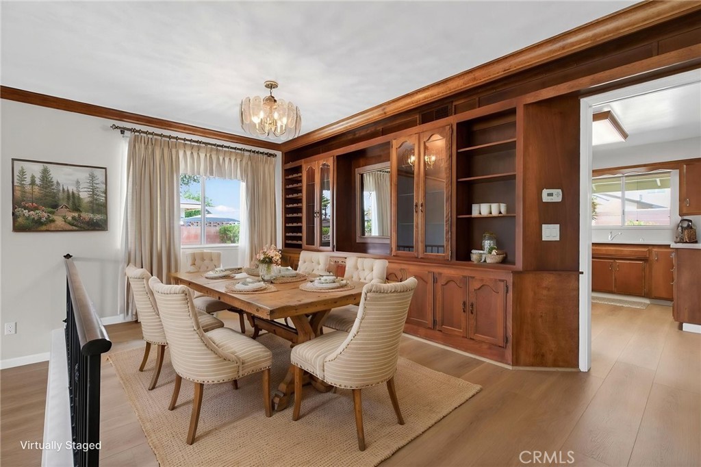 4963 Carlingford Avenue Riverside, CA 92504 - Photo 6 of 33 a dining room with furniture a chandelier and wooden floor