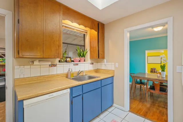 a kitchen with a sink and a window