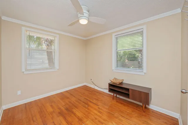 a bedroom with bed and a window